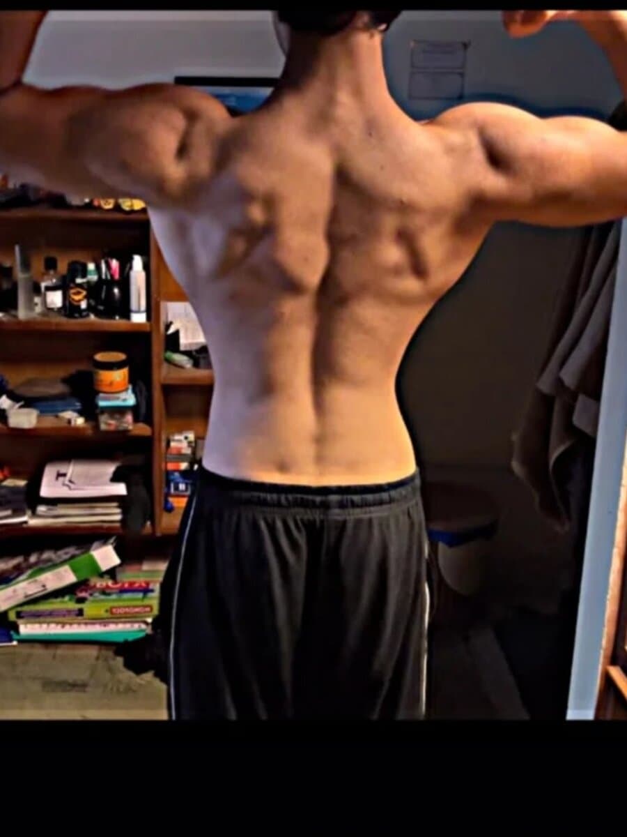 The same GymFinity client after two years of training, showing a much more developed back